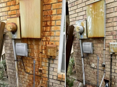 Close-up image showing brick rust removal process and cleaning results in Houston, TX