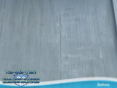 Close-up of vinyl siding oxidation showing chalky white residue and faded paint on exterior surface