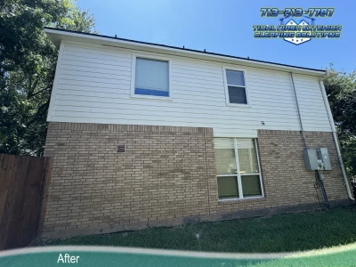 Clean Hardie Plank siding and brick after soft washing on a Sunrise Lakes home in Pearland, TX