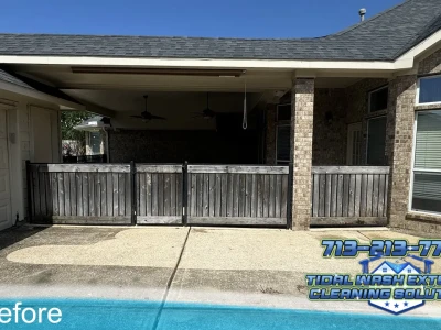 Older wood fence with visible organic growth before soft washing in Pearland, TX