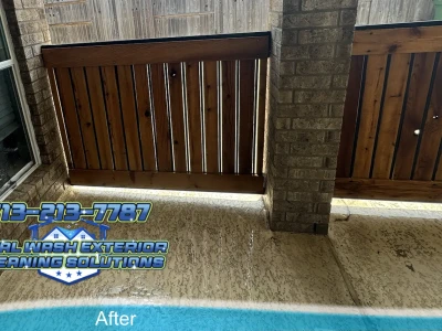 Wood fence near brick wall after soft washing and sealer application in Pearland